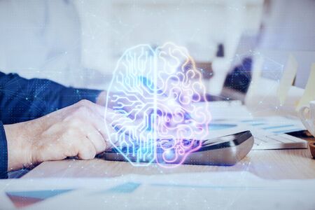 Man's hands withbrain double exposure drawing. Concept of human learning.の写真素材