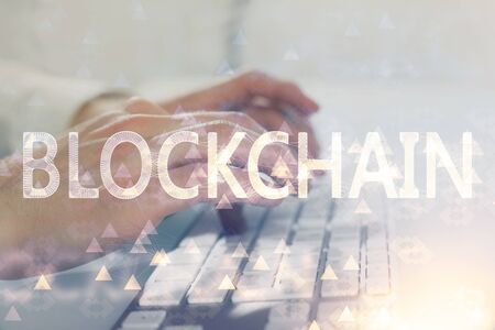 Crypto currency theme hologram with businessman working on computer on background. Concept of...