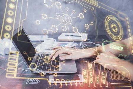Businessman with computer background with technology theme hologram. Concept of hightech. Multi...
