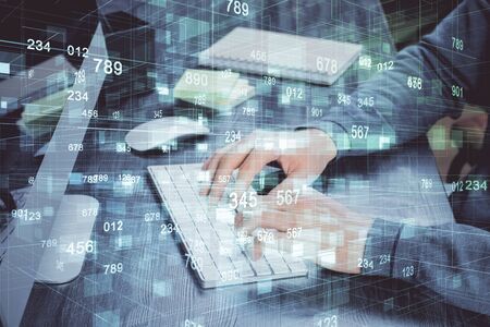 Double exposure of technology hologram with man working on computer background. Concept of big data.の写真素材