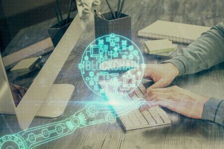 Blockchain theme hud with businessman working on computer on background. Concept of crypto chain....