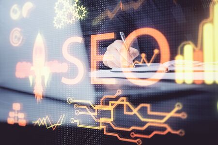 Man writing. With double exposure seo drawings.の写真素材