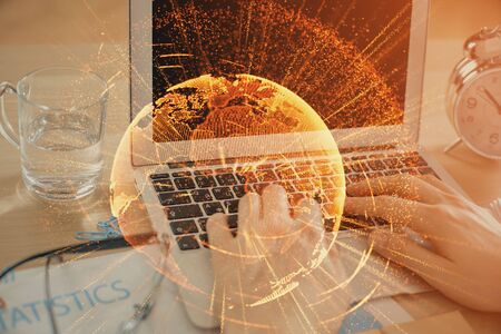 Social network theme hologram with businessman working on computer on background. Concept of world wide web. Double exposure.の写真素材