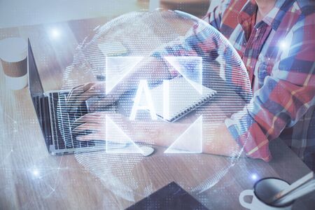 Businessman with computer background with technology theme hologram. Concept of big data. Double exposure.の写真素材