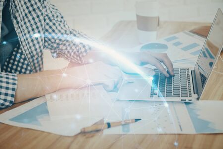 Social network theme hologram with businessman working on computer on background. Concept of world wide web. Double exposure.の写真素材