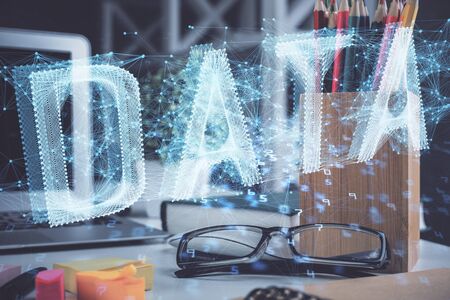 Data tech hologram with glasses on the table background. Concept of technology. Double exposure.の写真素材