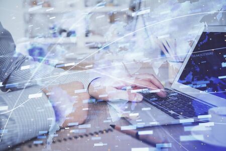 Businessman working on Laptop with technology theme drawing. Concept of big data. Double exposure.の写真素材