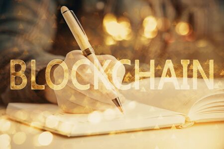 Cryptocurrency hologram over womans hands writing background. Concept of blockchain. Double exposureの写真素材