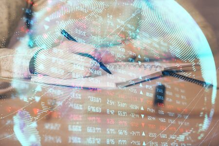 International business hologram over womans hands taking notes background. Concept of success. Double exposureの写真素材