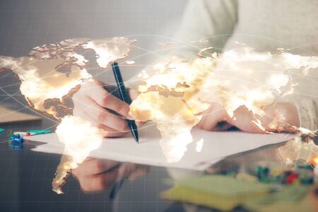 International business hologram over womans hands taking notes background. Concept of success. Double exposureの写真素材