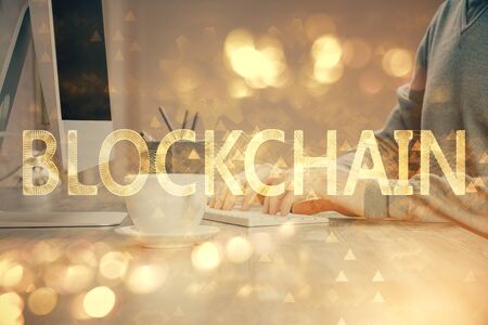 Blockchain theme hud with businessman working on computer on background. Concept of crypto chain. Multi exposure.の写真素材