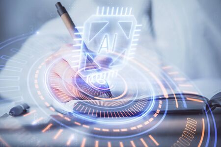Multi exposure of writing hand on background with data technology hologram. Concept of innovation.の写真素材