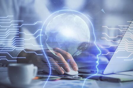 Man typing on keyboard background with brain hologram. Concept of big Data.