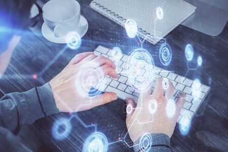 Double exposure of tech drawings with hands working on computer background. Concept of innovation.