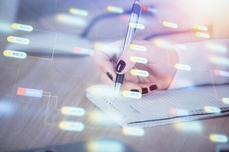 Multi exposure of womans writing hand on background with data technology hud. Concept of innovation.の写真素材
