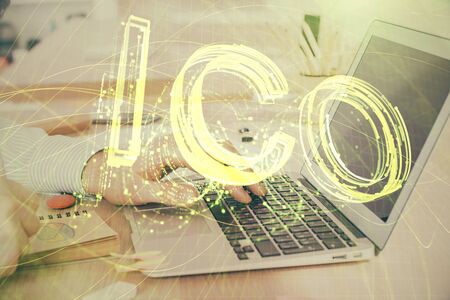 Blockchain theme hud with businessman working on computer on background. Concept of crypto chain. Double exposure.の写真素材