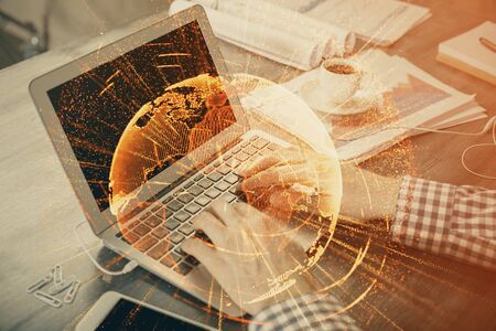 Social network theme hologram with businessman working on computer on background. Concept of world...
