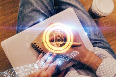 Mans hands working with notes background. Cryptocurrency and finance concept.の写真素材
