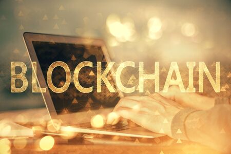 Blockchain theme hud with businessman working on computer on background. Concept of crypto chain. Double exposure.の写真素材