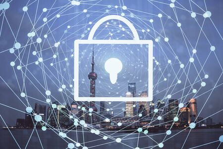 Lock icon hologram on city view with skyscrapers background multi exposure. Data security concept.