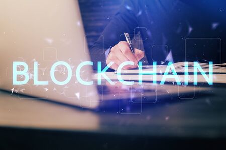 Mans hands working with notes background. Cryptocurrency and finance concept.