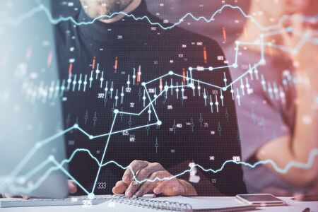 Forex graph with businessman working on computer in office on background. Concept of analysis....