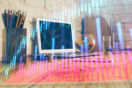 Multi exposure of graph and financial info and work space with computer background. Concept of international online trading.の写真素材