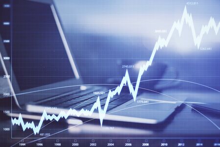 Forex market chart hologram and personal computer background. Multi exposure. Concept of investment.