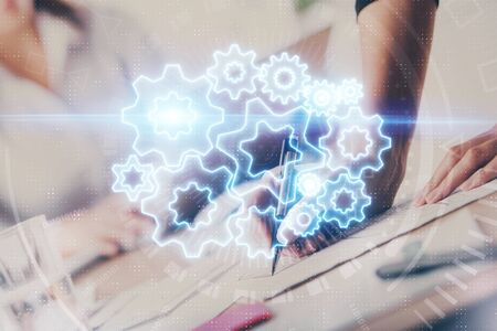 International business hologram over hands taking notes background. Concept of success. Multi...