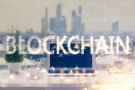 Double exposure of blockchain and crypto economy theme hologram and table with computer background. Concept of bitcoin cryptocurrency.の写真素材