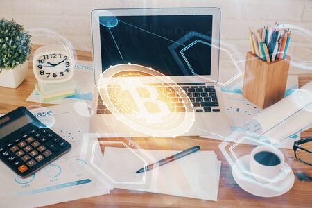 Double exposure of blockchain and crypto economy theme hologram and table with computer background. Concept of bitcoin cryptocurrency.の写真素材