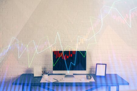 Stock market chart hologram drawn on personal computer background. Multi exposure. Concept of investment.の写真素材