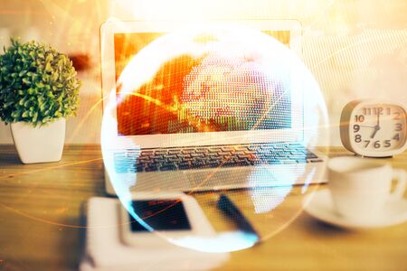 Double exposure of business theme icons and work space with computer background. Concept of success.の写真素材