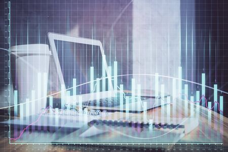 Stock market graph and table with computer background. Double exposure. Concept of financial analysis.の写真素材