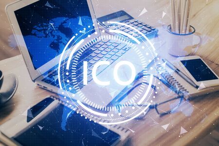 Double exposure of blockchain and crypto economy theme hologram and table with computer background. Concept of bitcoin cryptocurrency.の写真素材