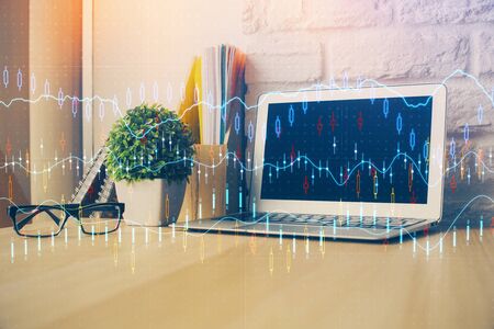 Multi exposure of forex chart and work space with computer. Concept of international online trading.の写真素材