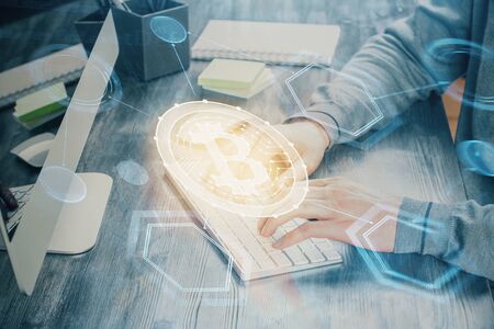 Blockchain theme hud with businessman working on computer on background. Concept of crypto chain. Multi exposure.の写真素材