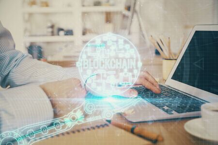 Blockchain theme hud with man working on computer on background. Concept of crypto chain. Double...