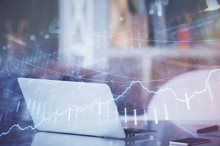 Forex Chart hologram on table with computer background. Double exposure. Concept of financial...