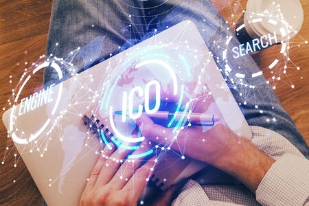 Mans hands working with notes background. Cryptocurrency and finance concept.