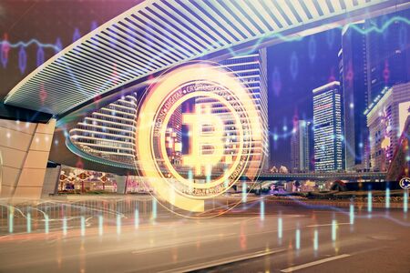Multi exposure of cryptocurrency theme hologram drawing and city veiw background. Concept of blockchain and bitcoin.の写真素材