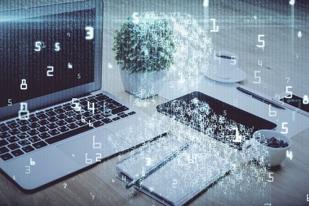 Double exposure of table with computer on background and data theme drawing. Concept of innovation.