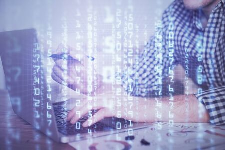 Businessman with computer background with technology theme hologram. Concept of hightech. Multi...