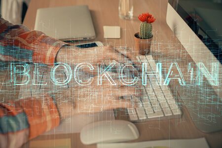 Blockchain theme hud with man working on computer on background. Concept of crypto chain. Double exposure.の写真素材