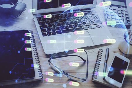 Double exposure of table with computer on background and data theme drawing. Concept of innovation.の写真素材