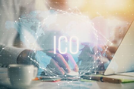Blockchain theme hologram with man working on computer on background. Concept of crypto chain....