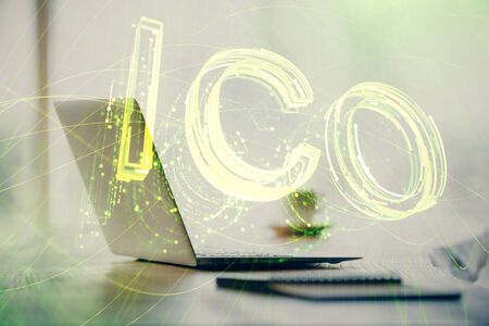 Double exposure of blockchain and crypto economy theme hologram and table with computer background. Concept of bitcoin cryptocurrency.の写真素材