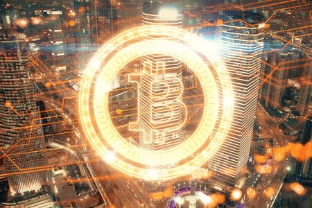 Multi exposure of cryptocurrency theme hologram drawing and city veiw background. Concept of blockchain and bitcoin.の写真素材