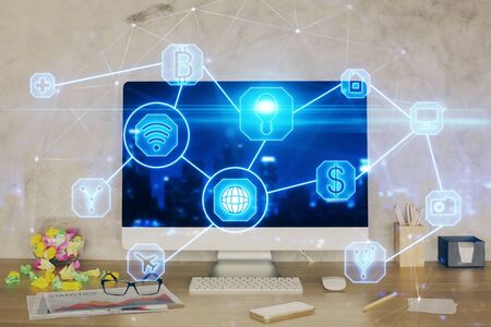 Computer on desktop with social network hologram. Double exposure. Concept of international people connections.の写真素材