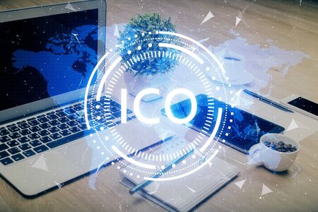 Double exposure of blockchain and crypto economy theme hologram and table with computer background. Concept of bitcoin cryptocurrency.の写真素材